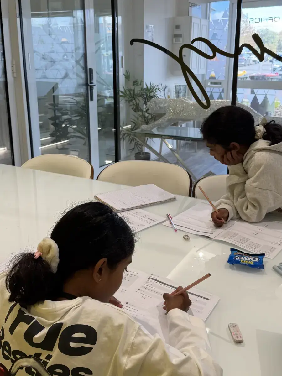 Students sitting together and sharing ideas during learning